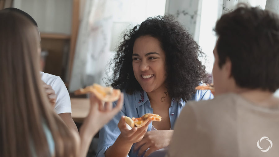 a woman eating pizza