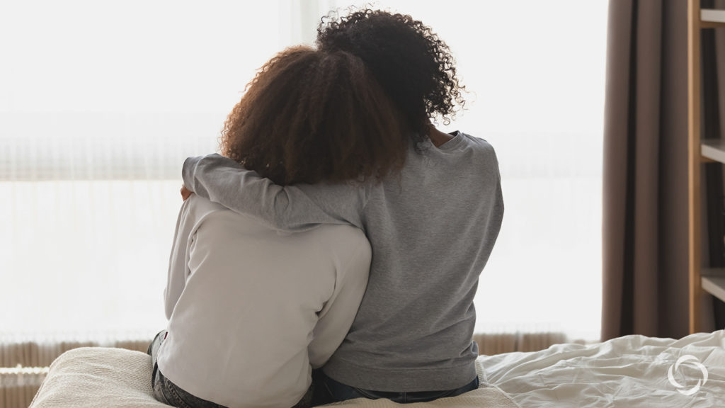 two woman hugging