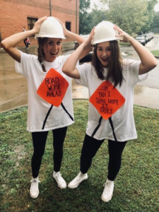 Two woman dressed as construction workers